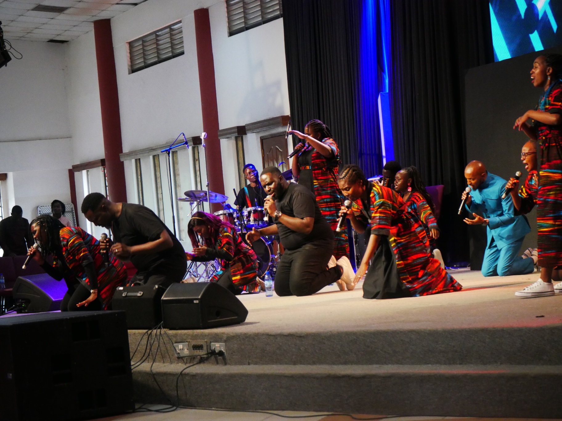 Ensemble kneeling in worship